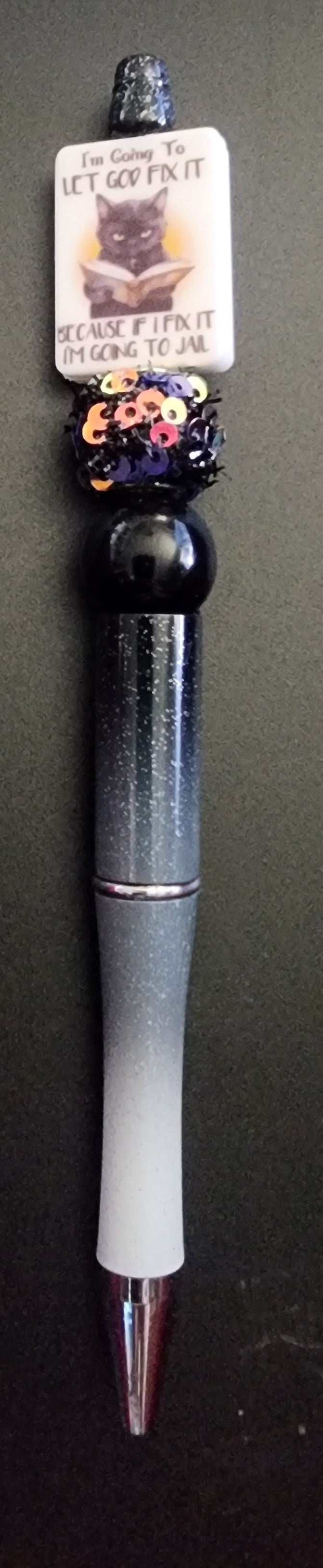 Cat reading a book pen