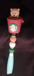 Light green box cutter with bear in starbucks cup