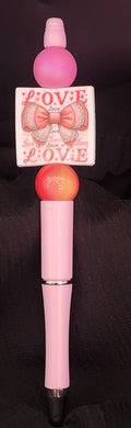 Light pink pen with white square focal love and bow