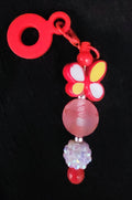 Red straw charm with butterfly