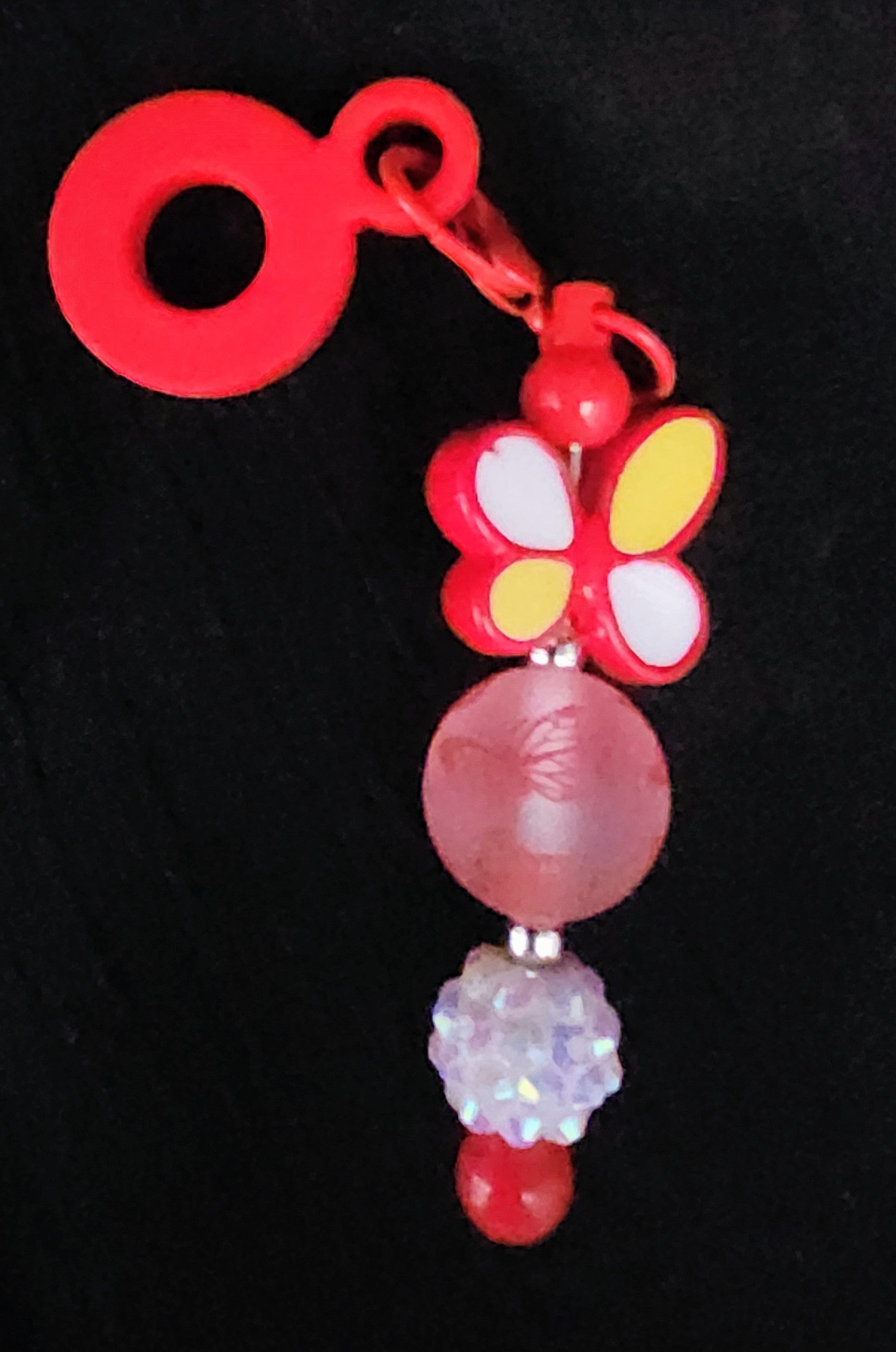 Red straw charm with butterfly