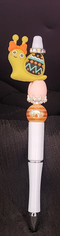 White pen with snail focal
